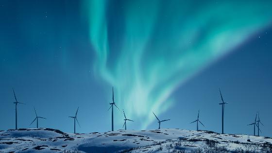 48106210-wind-power-plants-on-a-hill-in-winter-night-with4.jpg