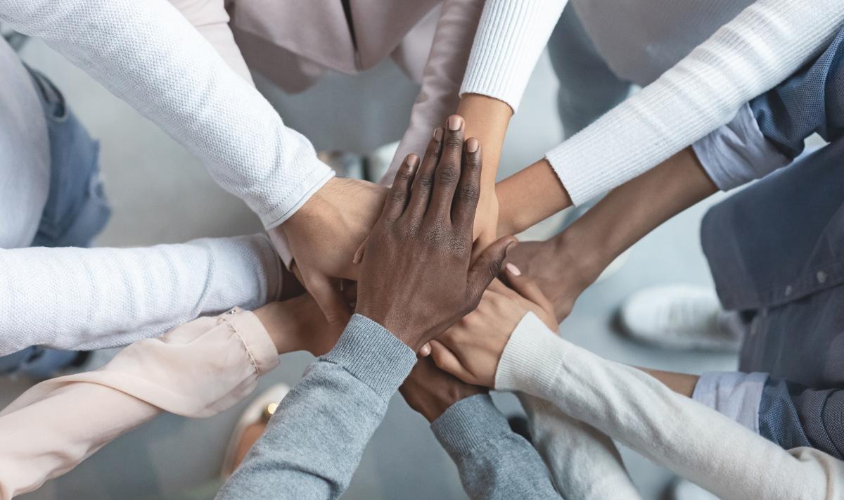 mp65918541-international-business-team-putting-hands-together-in.jpg